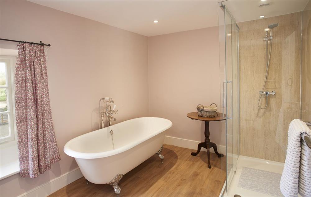 Master en-suite with beautiful roll top bath and spacious shower at Lime Kiln Farmhouse, Coneysthorpe
