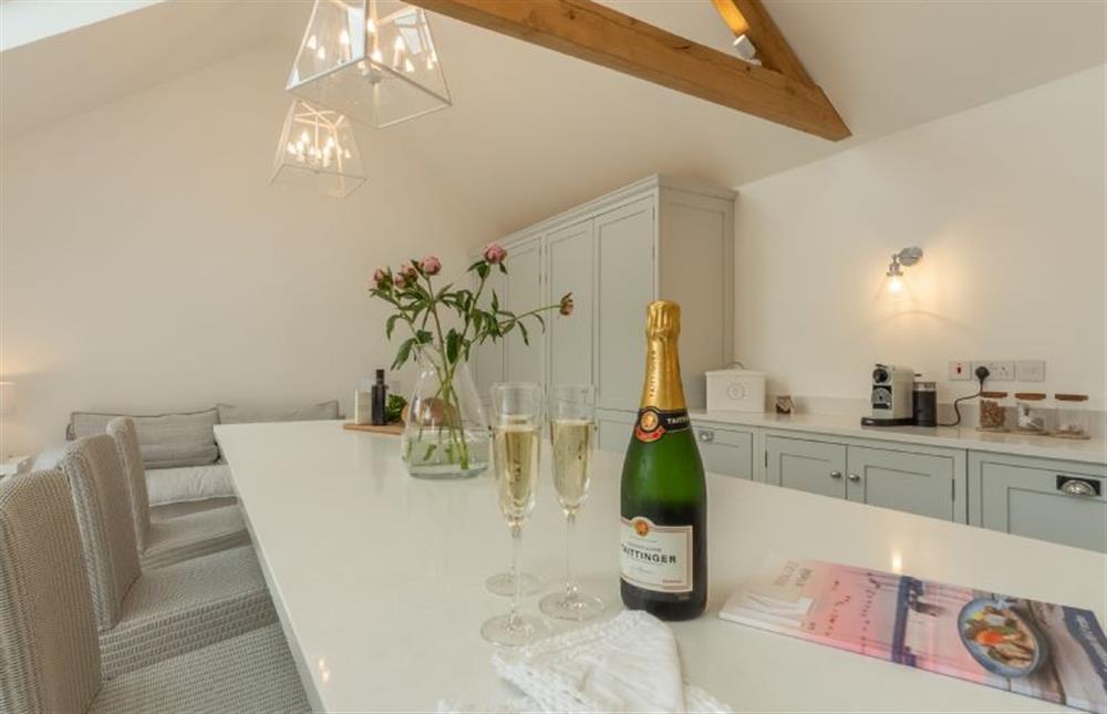 Limestone House, Norfolk: The kitchen features a sit-up breakfast bar and island at Limestone House, Burnham Market