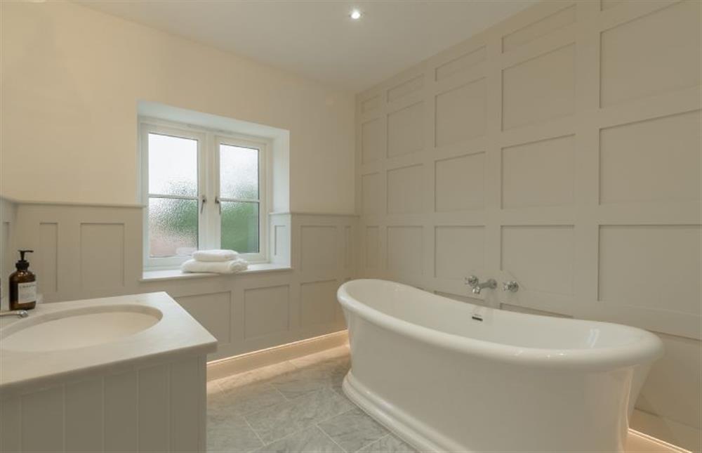 Limestone House, Norfolk: The master bedroomfts en-suite bathroom with beautiful French style slipper bath