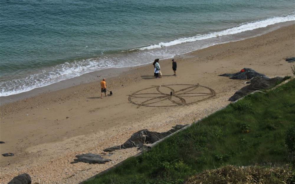 Sand art on Cove beach. at Limpet in Torcross