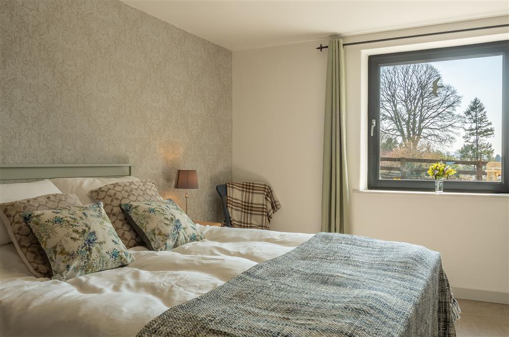 Bedroom one with stunning countryside views at Linden Barn, Orton