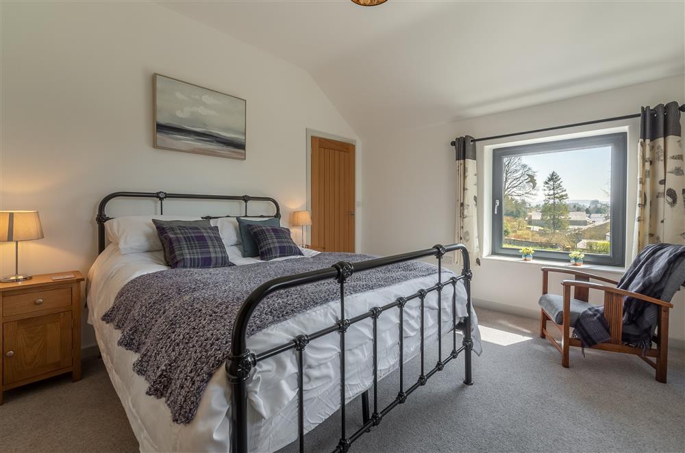 Bedroom three with 5’ king-size bed and stunning countryside views at Linden Barn, Orton
