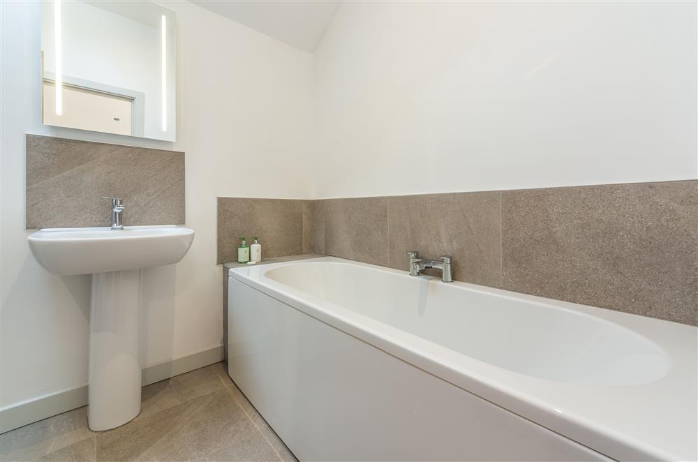 Family bathroom with bath, separate shower, wash basin and WC at Linden Barn, Orton