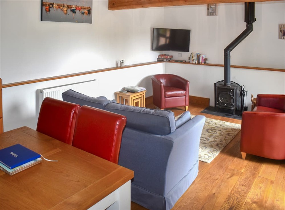 Open plan living space at Linhay Cottage in Lyme Regis, Devon