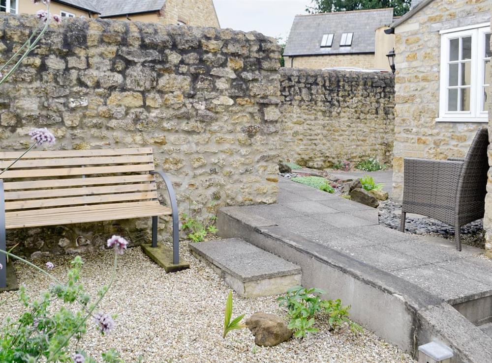 Enclosed garden and patio area at Linnets in Beaminster, Dorset