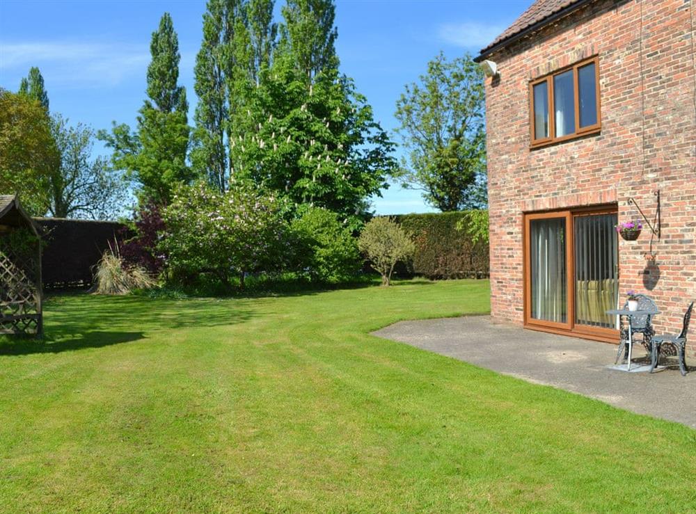 Large lawned garden at Linton Woods Farm in Linton-on-Ouse, near York, North Yorkshire