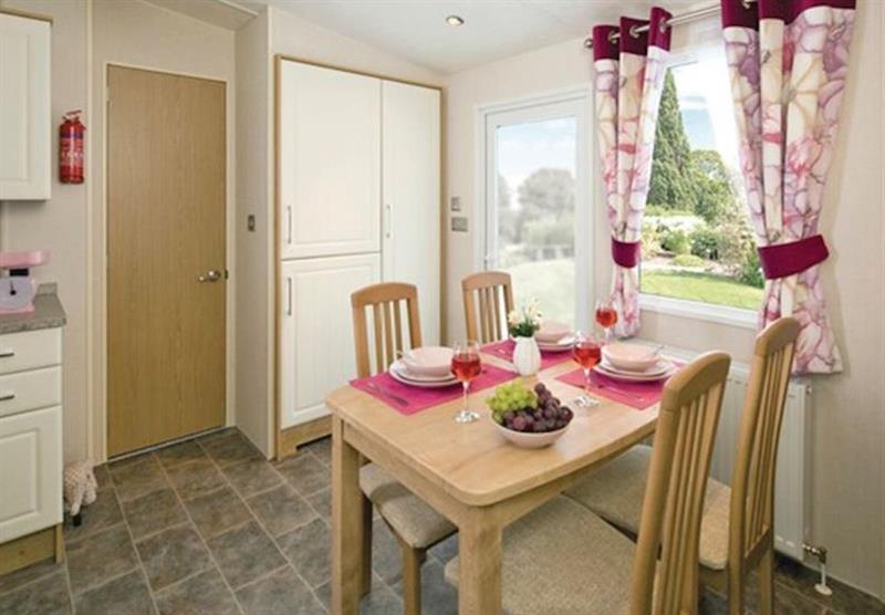 Dining area in a Select Plus 3 at Liskey Hill Holiday Park in Perranporth, North Cornwall