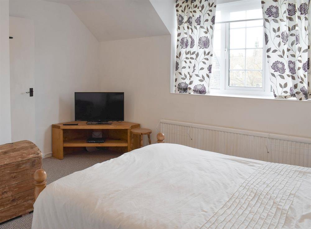 TV in double bedroom at Listers Lodge in Brotton, near Saltburn-by-the-Sea, Cleveland
