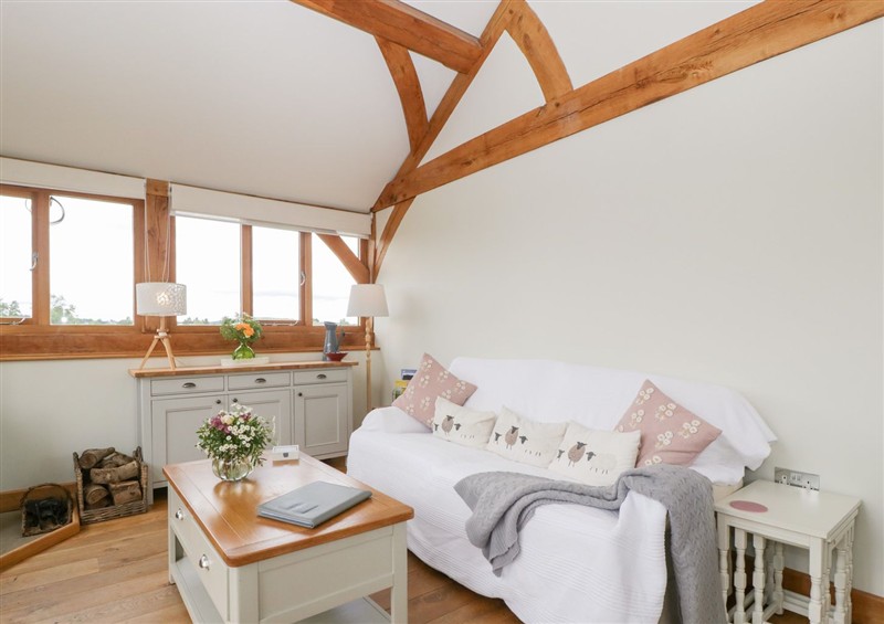 Relax in the living area at Little Acorn Cottage, Munsley near Ledbury