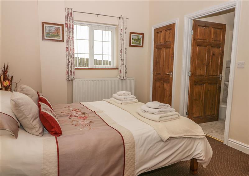 A bedroom in Little Argham Cottage at Little Argham Cottage, Filey