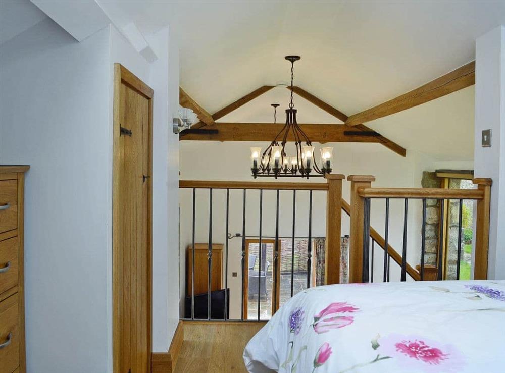 Galleried double bedroom at Little Barn in Govilon, near Abergavenny, Monmouthshire, Gwent