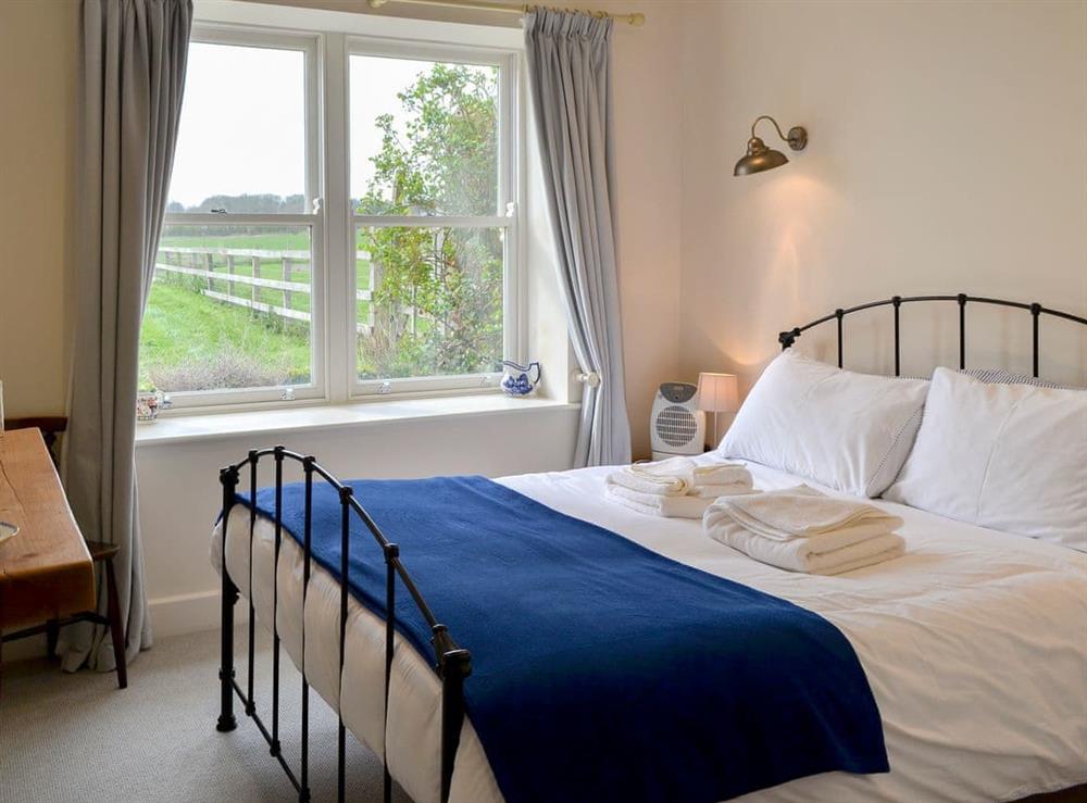 Relaxing bedroom with kingsize bed at Little Barn Tynely Farm in Embleton, near Alnwick, Northumberland