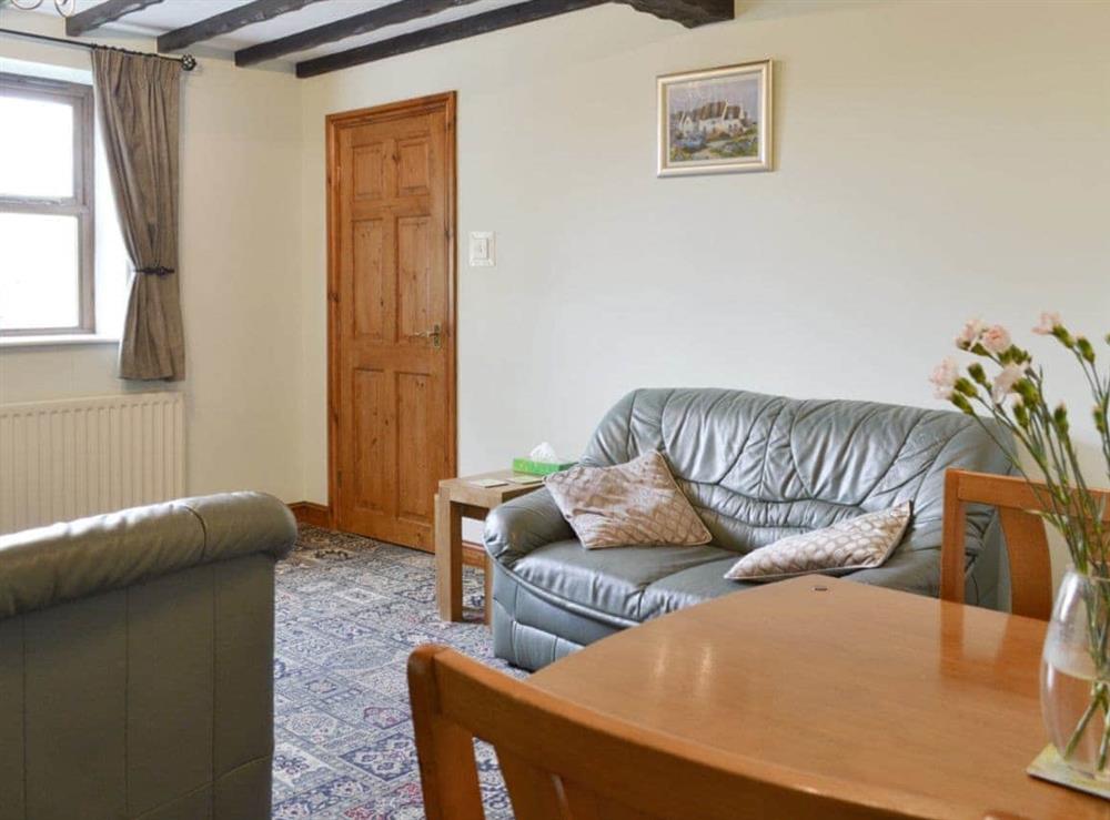 Convenient dining area within living room at Little Barn in York, North Yorkshire