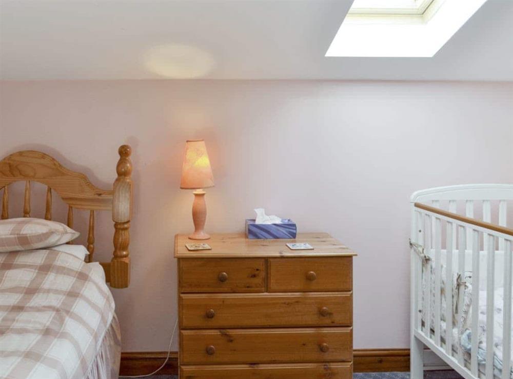 Peaceful single bedroom with cot at Little Barn in York, North Yorkshire