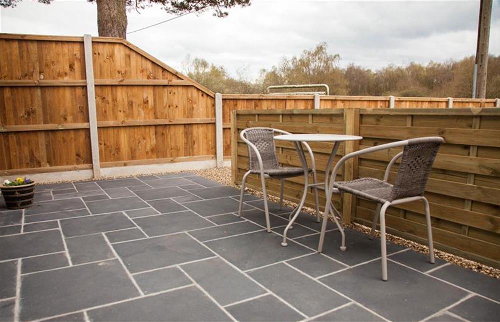 Front terrace:  Screened from drive with table and seating for two at Little Birches, Roydon near Kings Lynn
