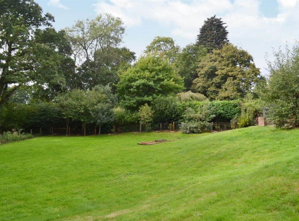 The garden has great views across the valley at Little Birketts Cottage in Holmbury St Mary, near Dorking, Surrey
