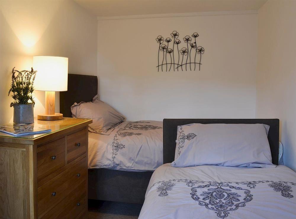 Twin bedroom at Little Birketts Cottage in Holmbury St Mary, near Dorking, Surrey