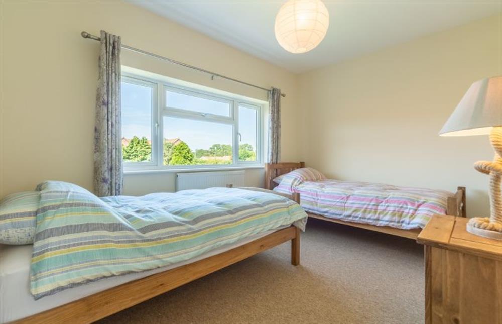 First floor:  Bedroom two with twin beds and built in wardrobe at Little Bunting, Heacham near Kings Lynn