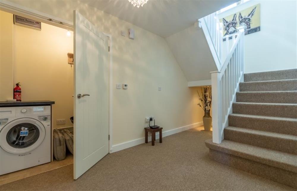 Ground floor:  Entrance hall with door to utility cupboard and stairs to first floor at Little Bunting, Heacham near Kings Lynn