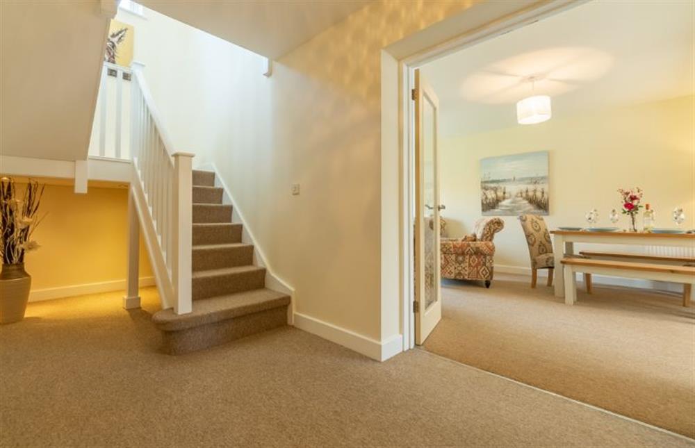 Ground floor:  Entrance hall with stairs to first floor and door to open plan living area at Little Bunting, Heacham near Kings Lynn