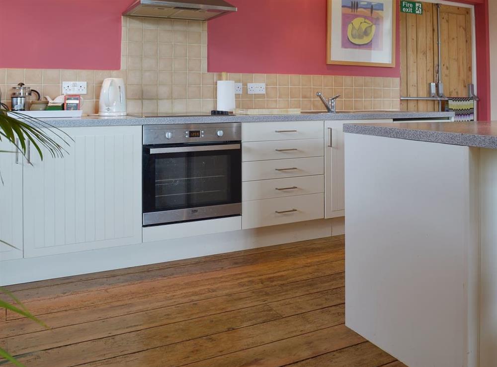 The stylish built-in kitchen at Little Burcott Loft in Wells, Somerset