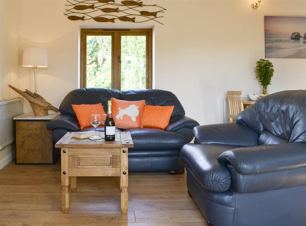 Stylish open-plan living space at Nuthatch Barn, 