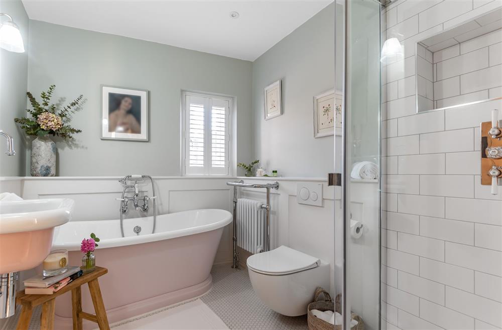 First floor: The first floor bathroom with roll-top bath and a separate shower  at Little Dorset Cottage, Blandford