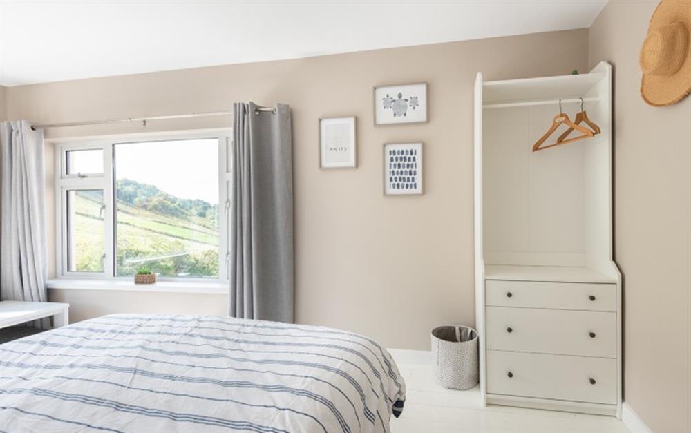 Bedroom 2 with dual aspect windows and views down the valley. at Little Downgate in East Portlemouth