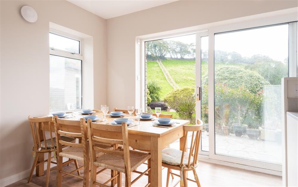 The dining area looking out over the garden at Little Downgate in East Portlemouth