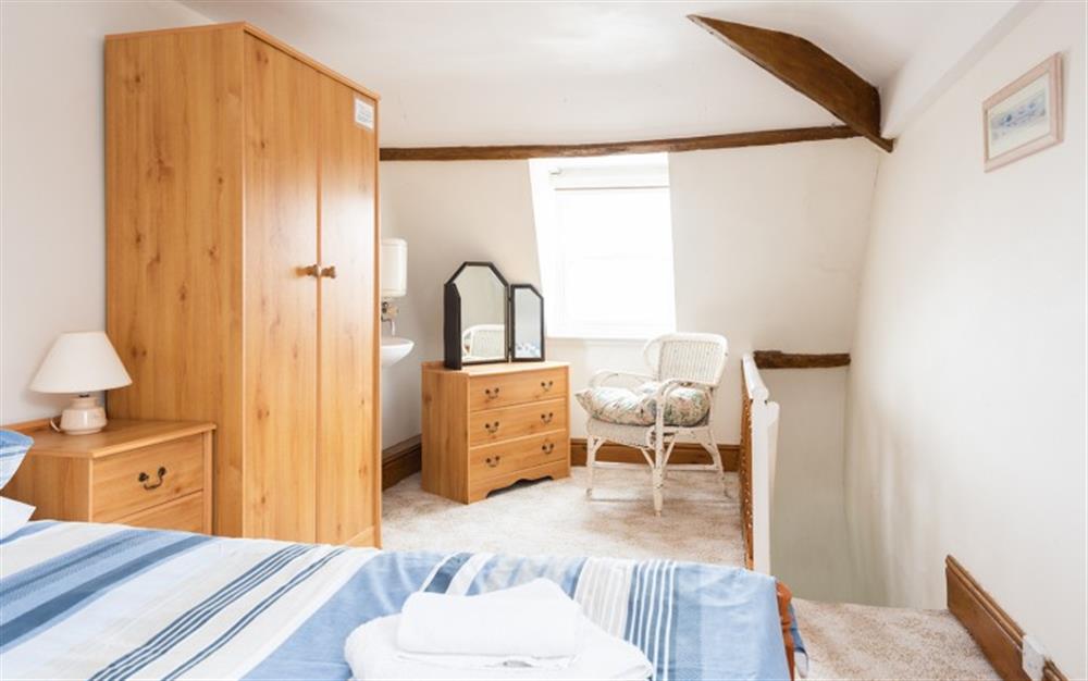 Twin bedroom storage and stairs at Little Galleon in Penzance