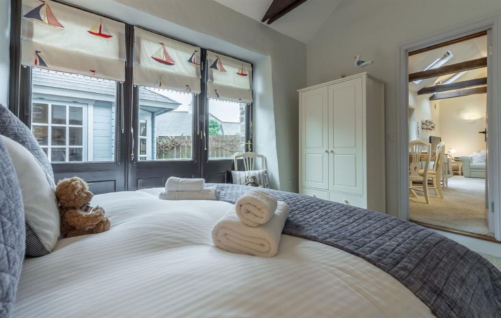 Bedroom two with king-size zip and link bed and en-suite shower room at Little Gull, Roserrow