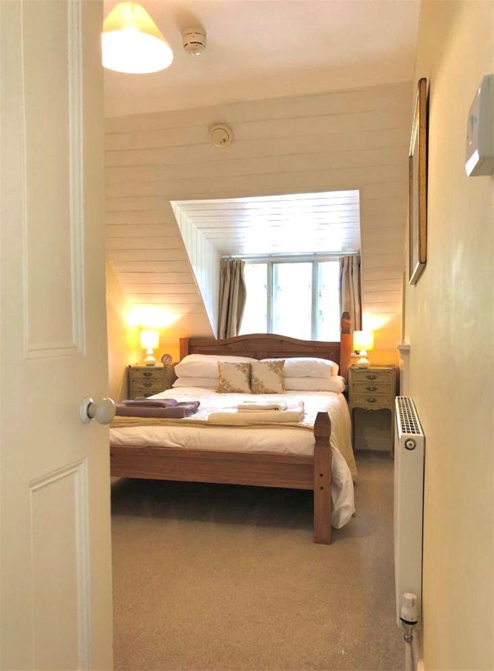 Bedroom two with a 4’6 double bed and en-suite shower room at Little Halt, Freshwater