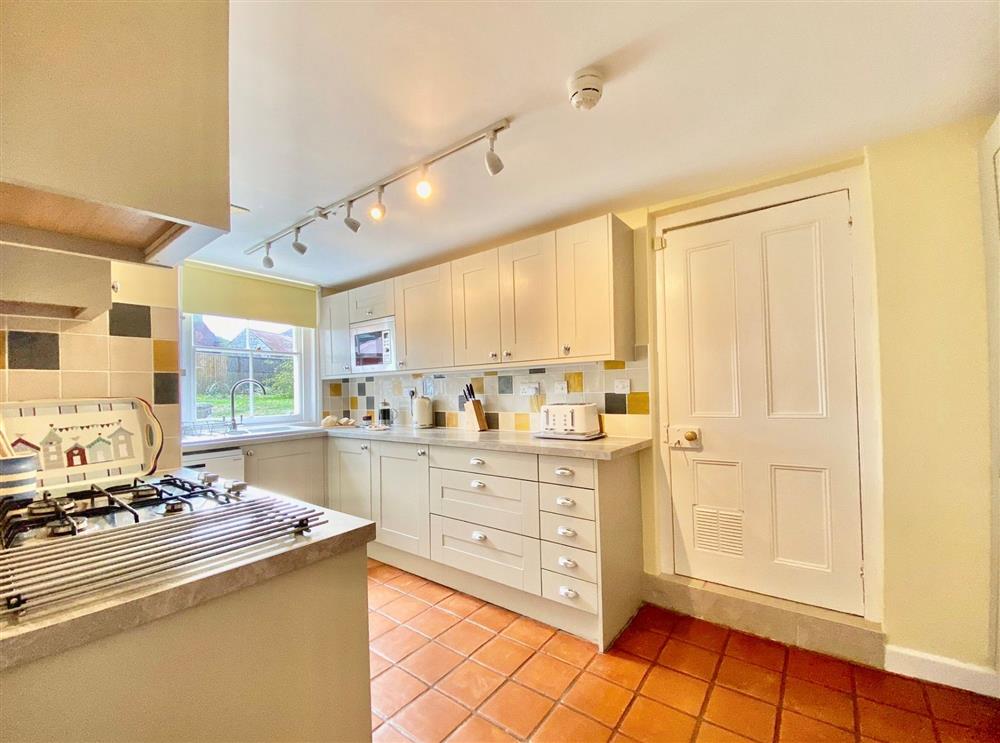 Fully-equipped kitchen with flagstone floor at Little Halt, Freshwater