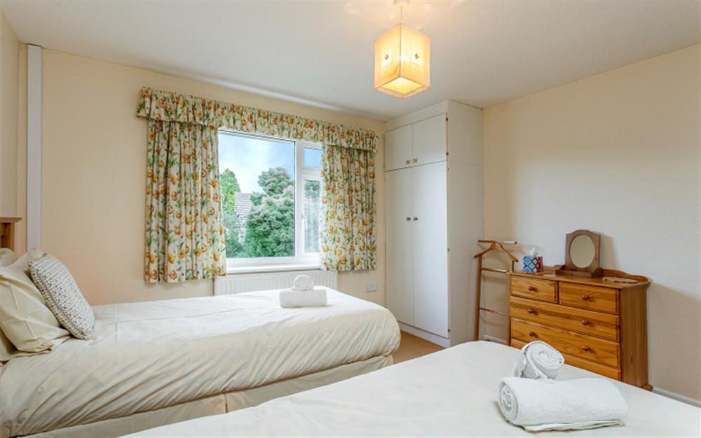 Bedroom 2 with twin beds overlooks the garden (photo 2) at Little Haven in Colyton