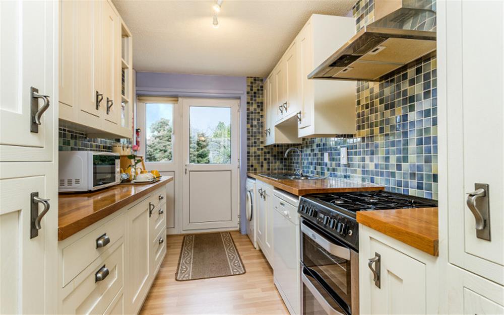 The kitchen is well equipped and leads out to the garden at Little Haven in Colyton