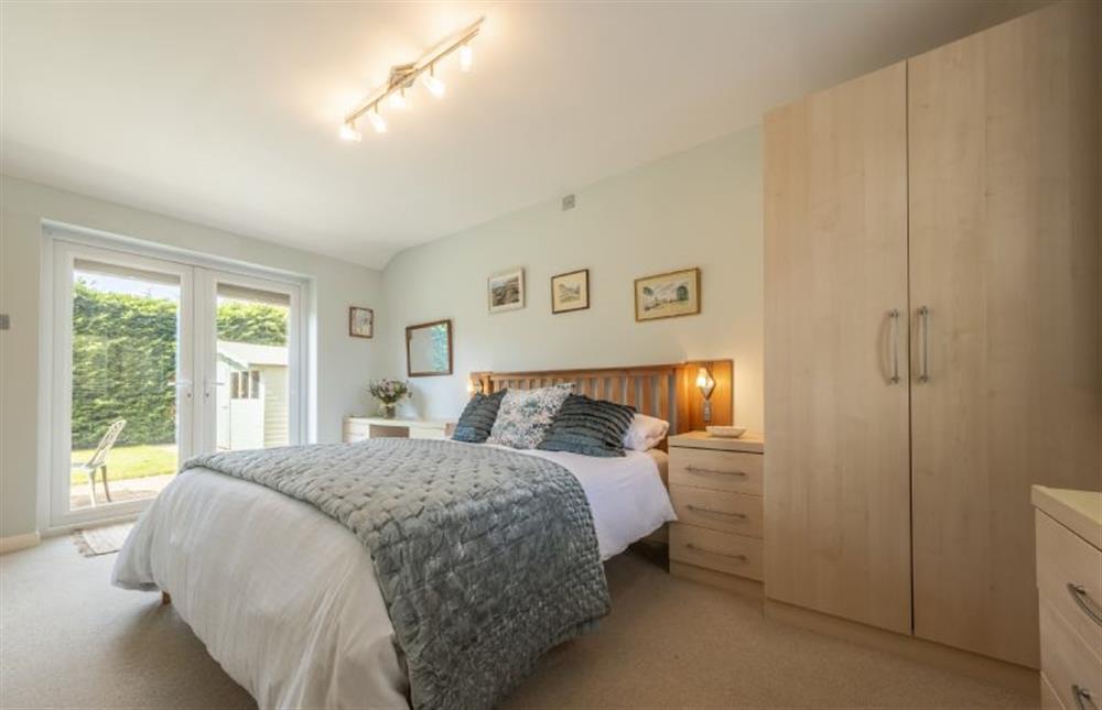 Bedroom with 5’ king-size bed at Little Hayman, Thornham near Hunstanton