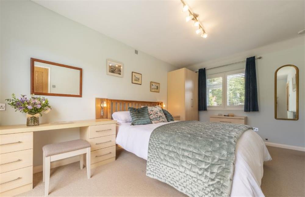 The bedroom is dual aspect at Little Hayman, Thornham near Hunstanton