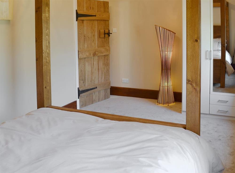 Comfortable four poster bedroom at Little Hoot in Baslow, near Bakewell, Derbyshire, England
