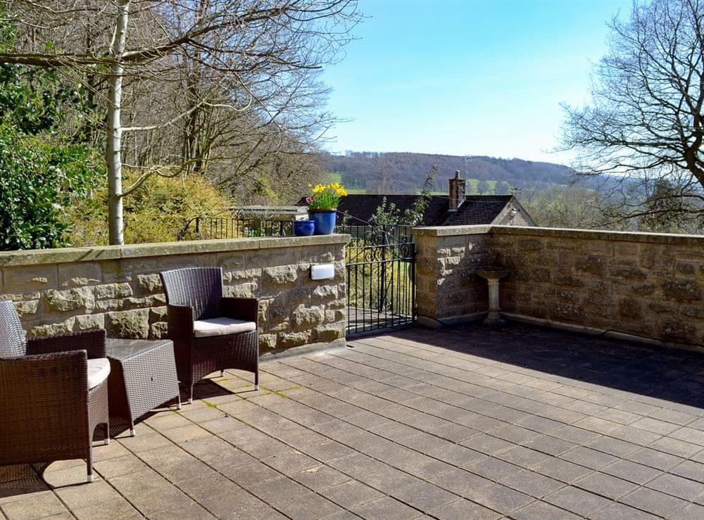 Large patio are with garden furniture at Little Hoot in Baslow, near Bakewell, Derbyshire, England