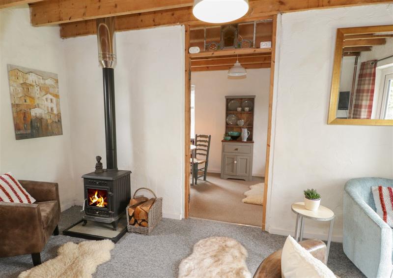 Relax in the living area at Little House, Red Wharf Bay