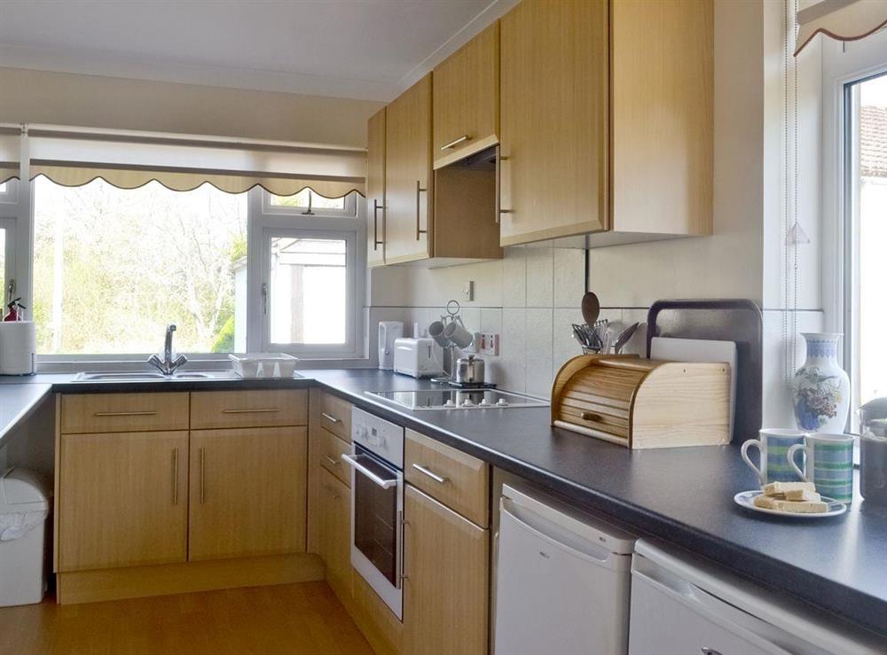 Well-equipped kitchen within open plan room at Little Knapp in Littlemill, near Nairn, Morayshire