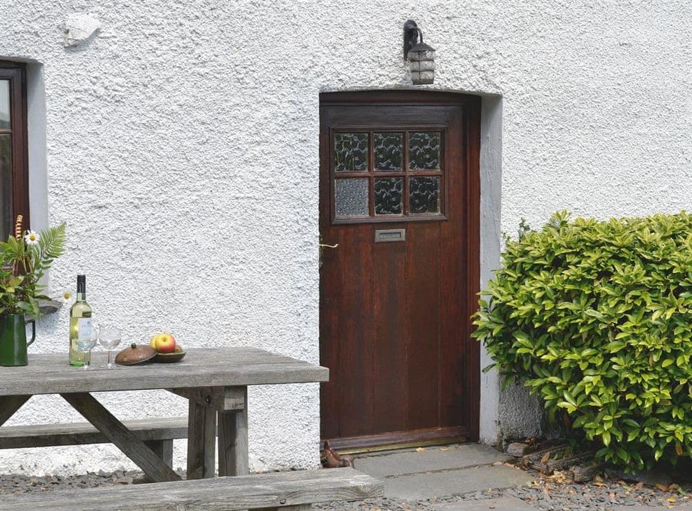 Charming exterior with picnic table stly seating at Little Knott in Blawith, near Coniston, Cumbria