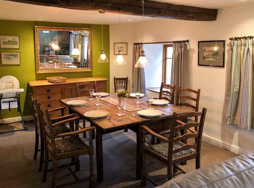 Dining area with large rustic dining table at Little Knott in Blawith, near Coniston, Cumbria