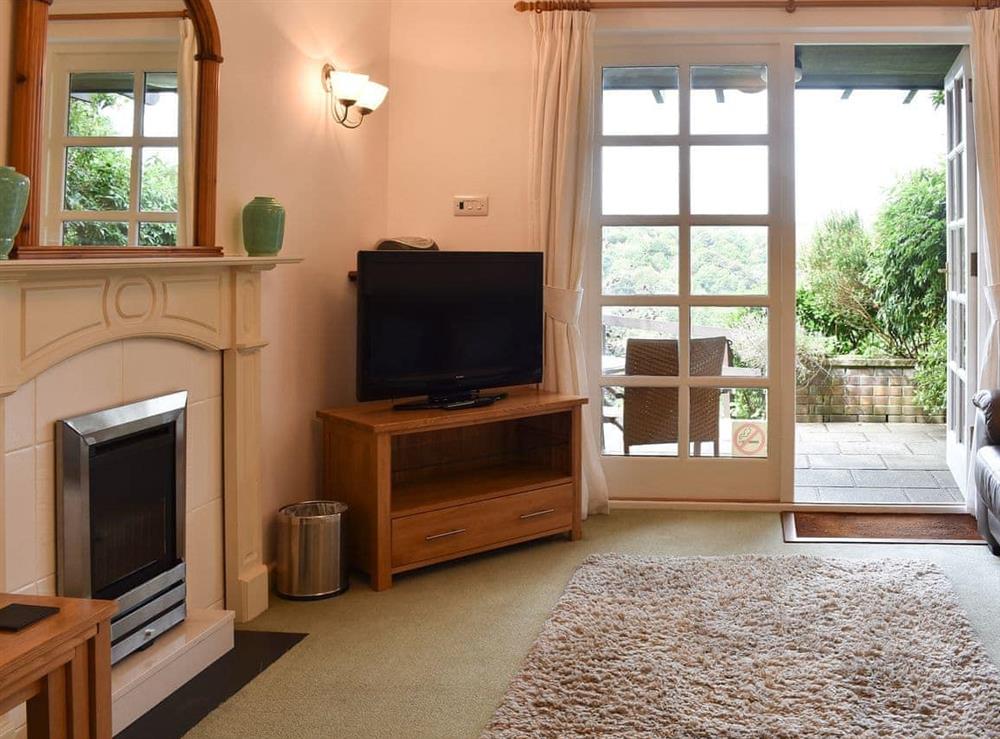 Cosy living room with patio access at Little Larnick in Looe, Cornwall