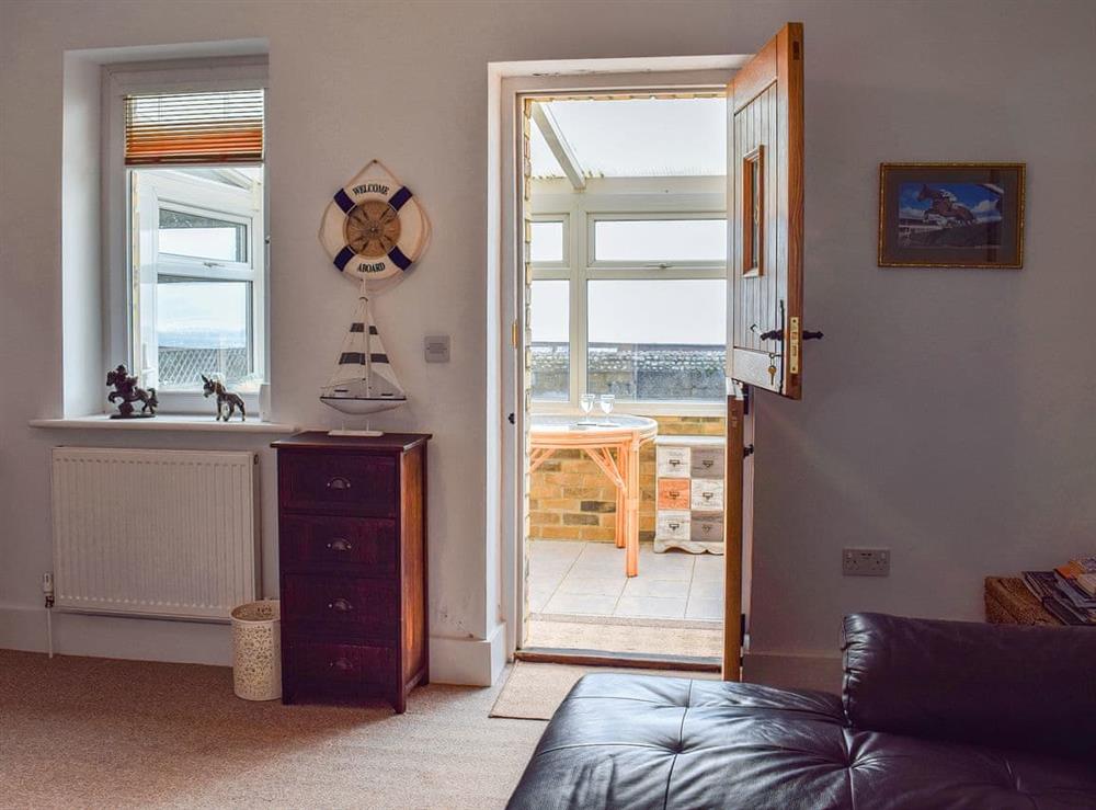Cosy living room with stable door from the sun room at Little Lismoy in Sandown, Isle of Wight