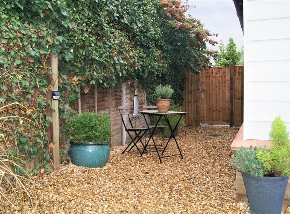 Paved patio area with outdoor furniture at Little Lodge in West Mersea, near Colchester, Essex