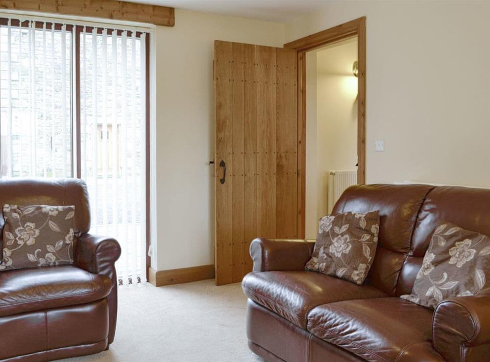 Comfy seating within the living room at Little Meadow in Dearham, near Maryport, Cumbria