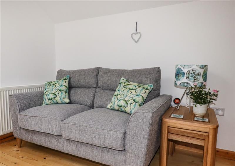 Relax in the living area at Little Orchard Barn, St Austell
