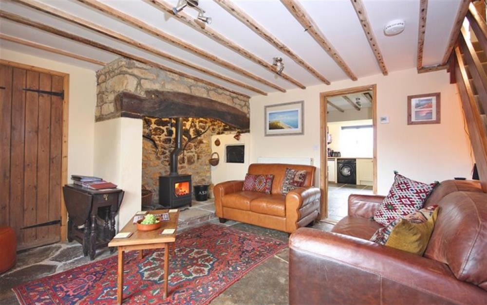 Comfortable sitting room with flagstone floor at Little Perhay in Bridport