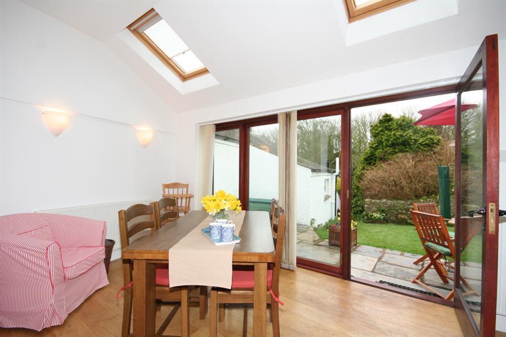 Dining area with doors leading out to garden at Little Perriotts in Kellaton, Nr Kingsbridge